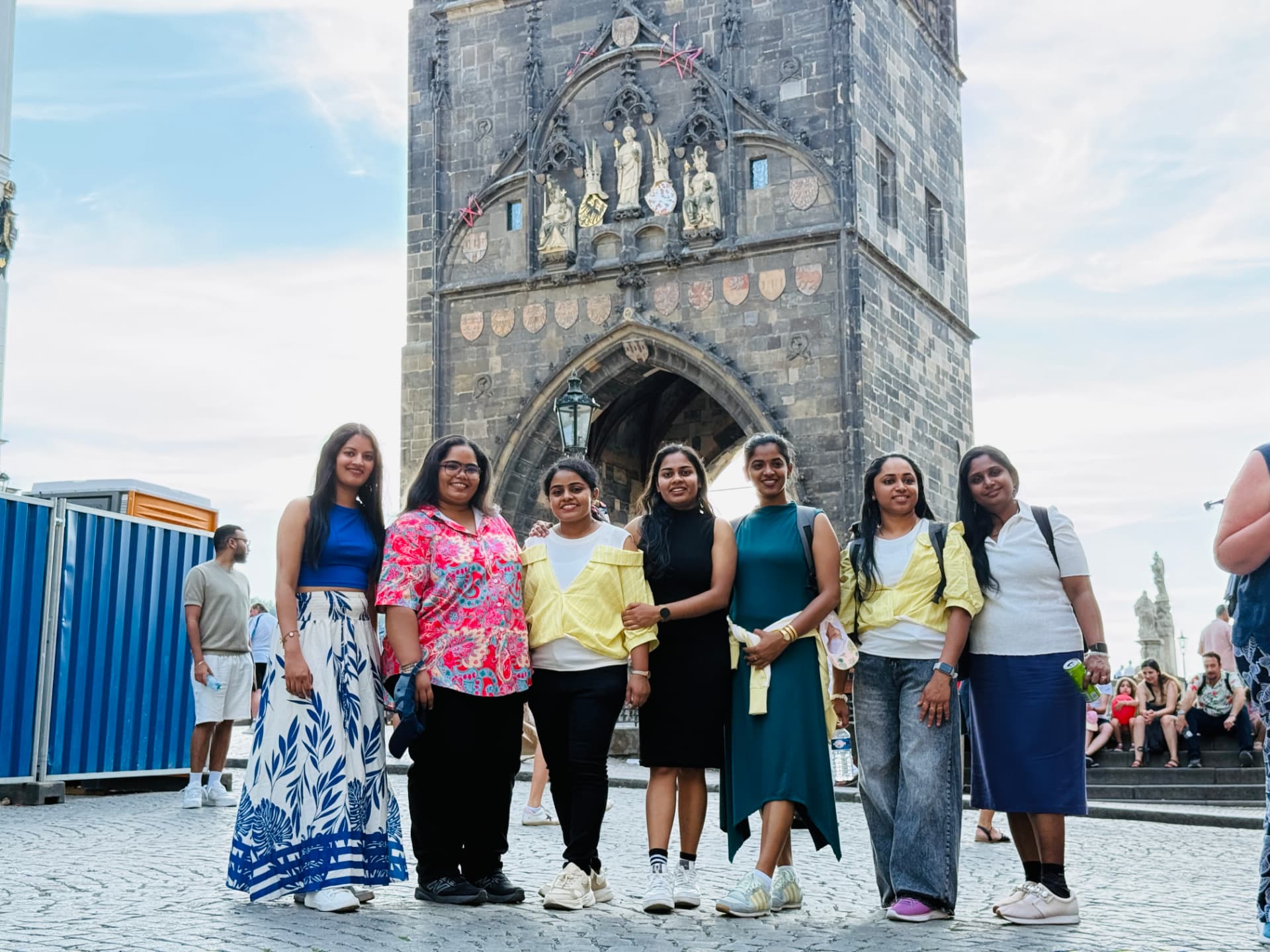 Friends posing together on Prague's Charles Bridge