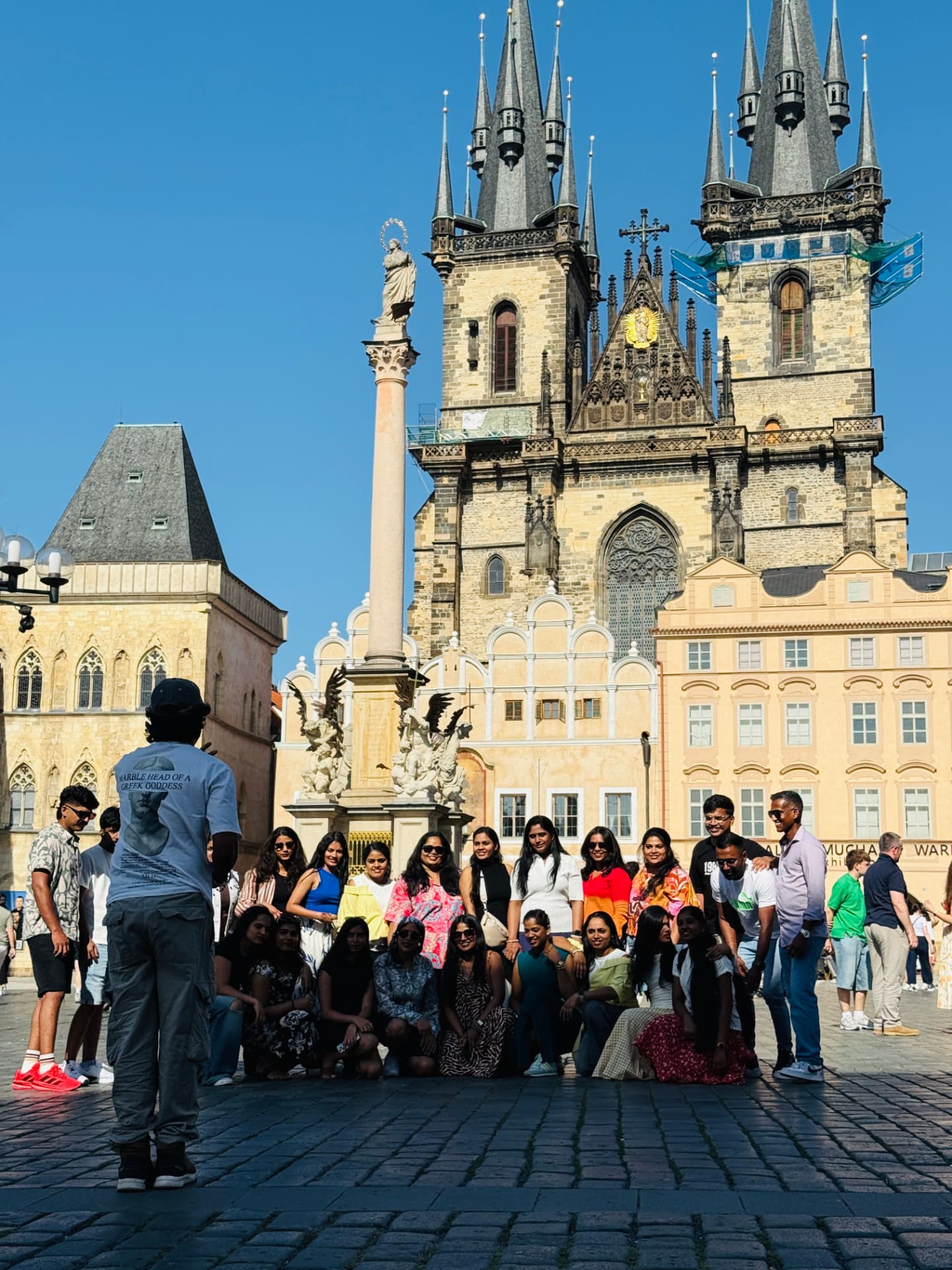 Group photo at Old Town Square in front of the Týn Church, Prague